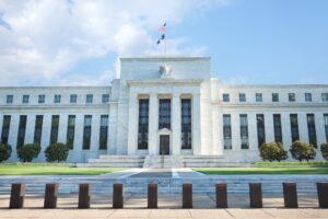 front of the federal reserve building, a private banking institution that controls the supply of money