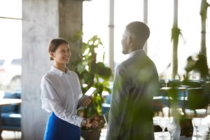 business man and woman shaking hands