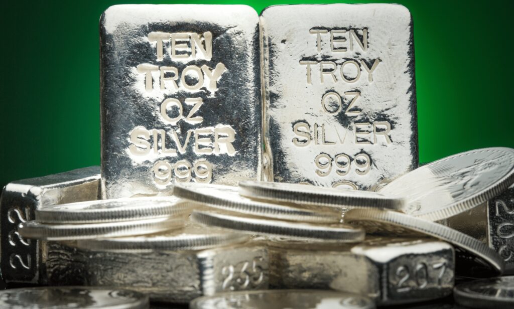 Close up of silver bullion with shaded green background