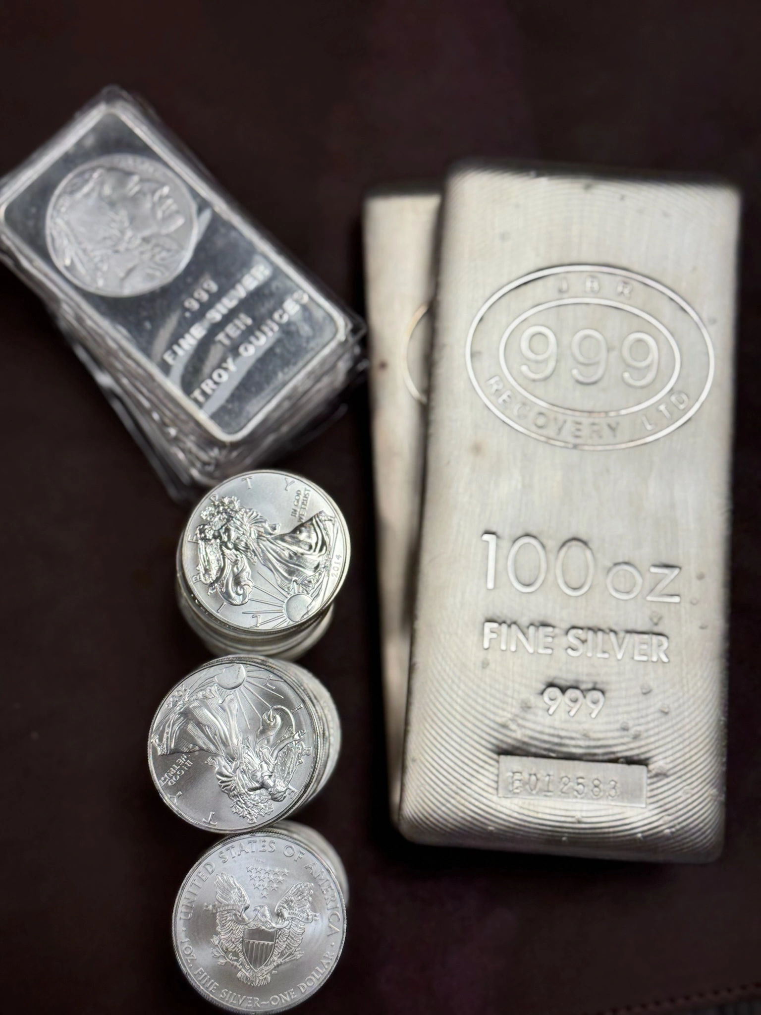 silver bars and coin